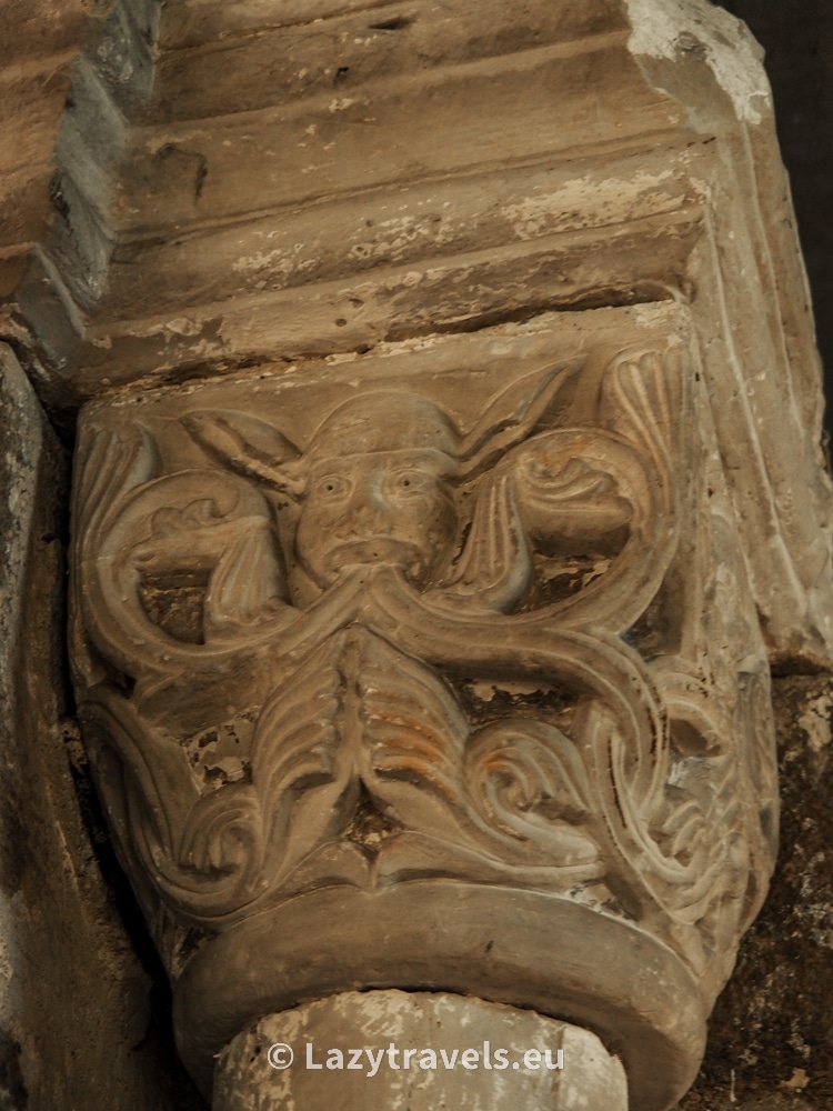 A capital with an image of a man with donkey ears from the church in Czerwińsk