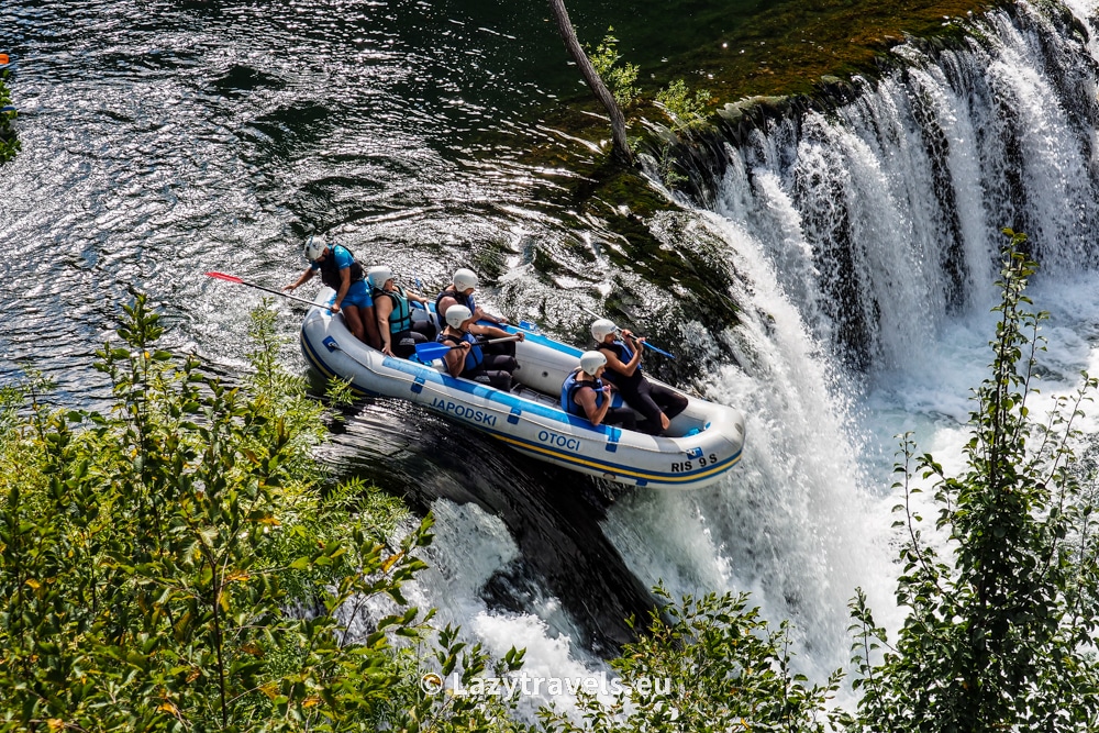 A pontoon with rafting participants on the Una River overcomes several spectacular cascades