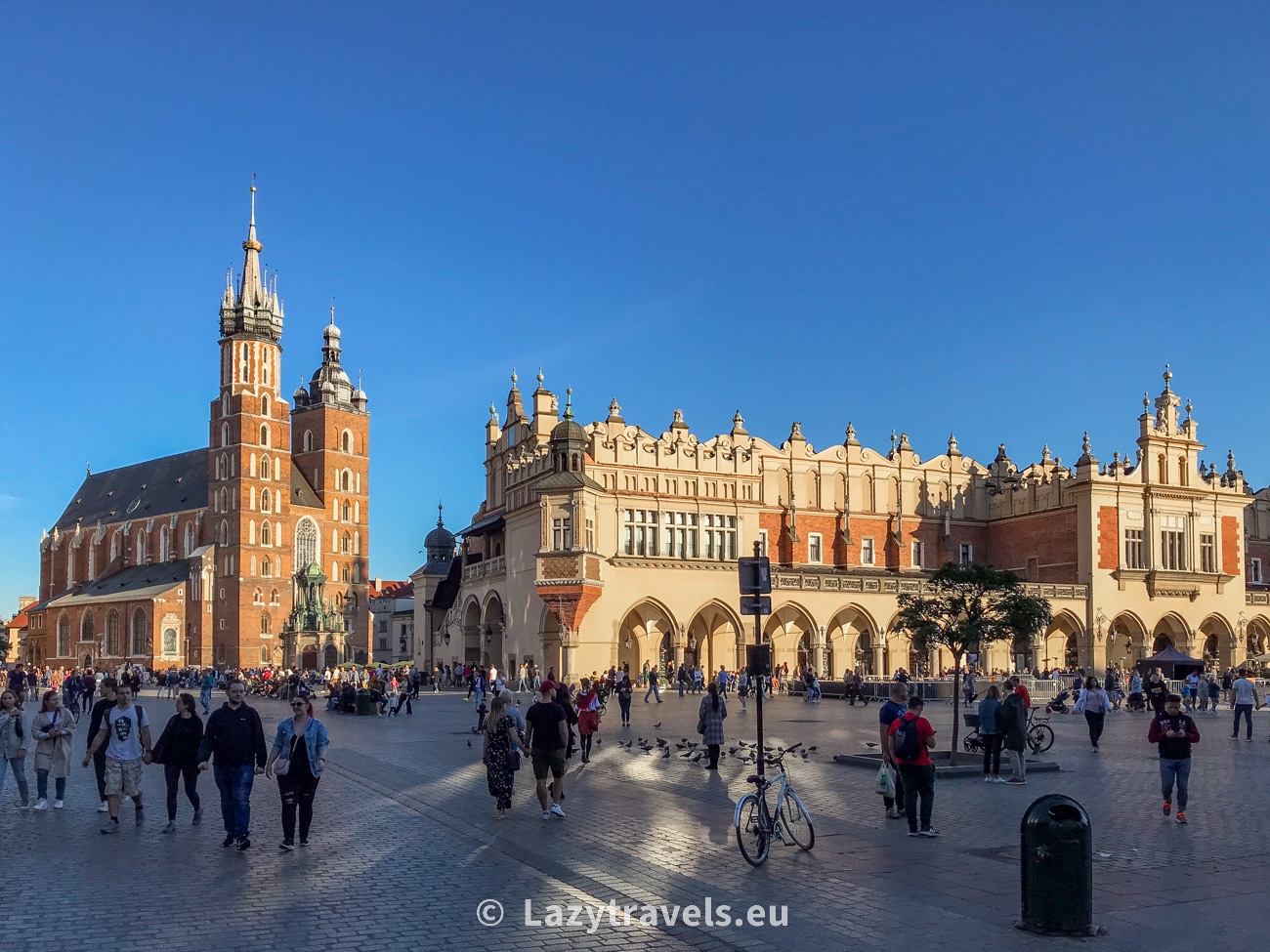 Market Square in Krakow. In the foreground, the Cloth Hall; on the left, St. Mary's Basilica—home to Veit Stoss's wooden masterpiece, the wooden altar.