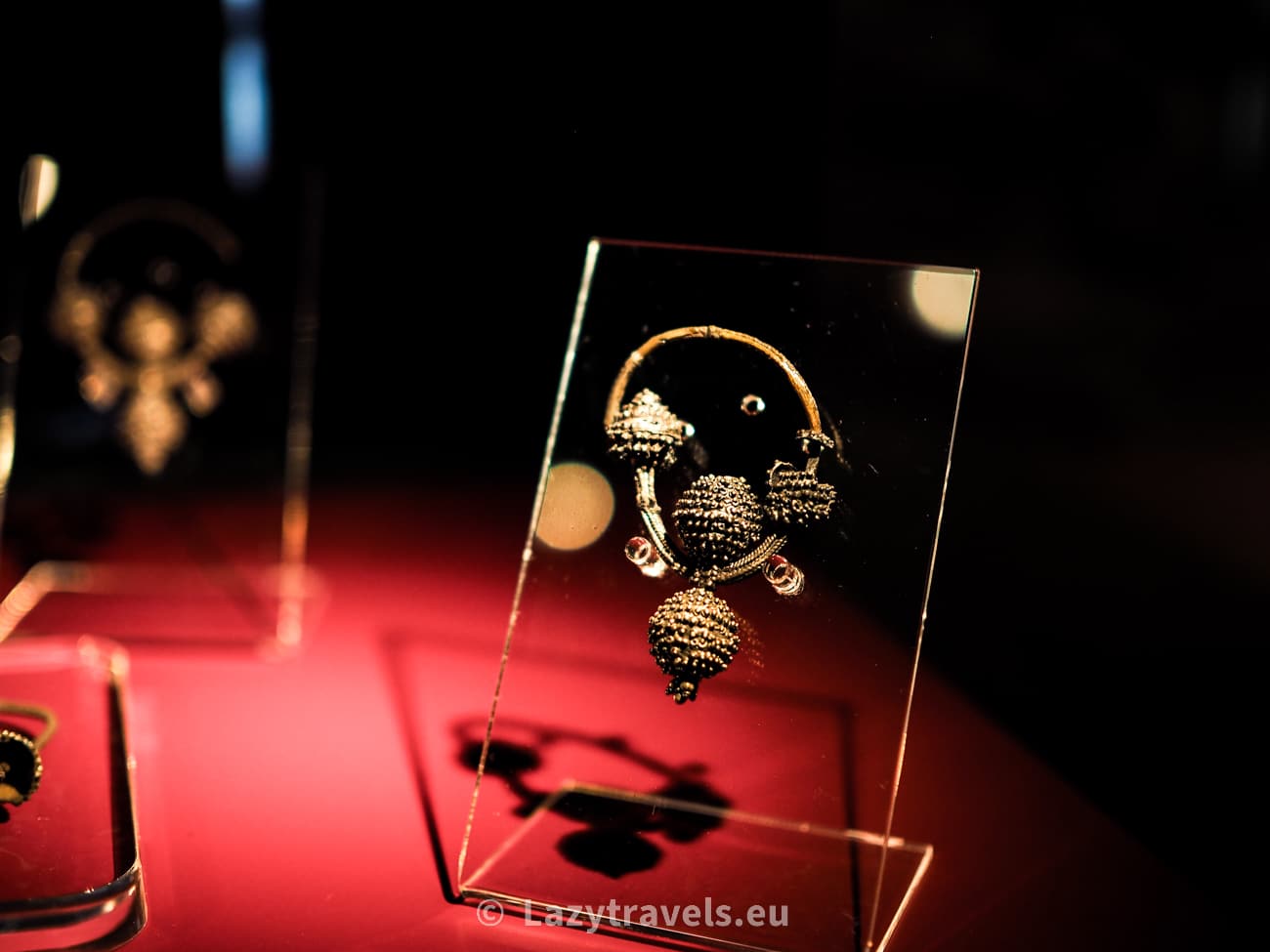 A treasure trove of earrings with raspberry-colored beads discovered in Wiślica