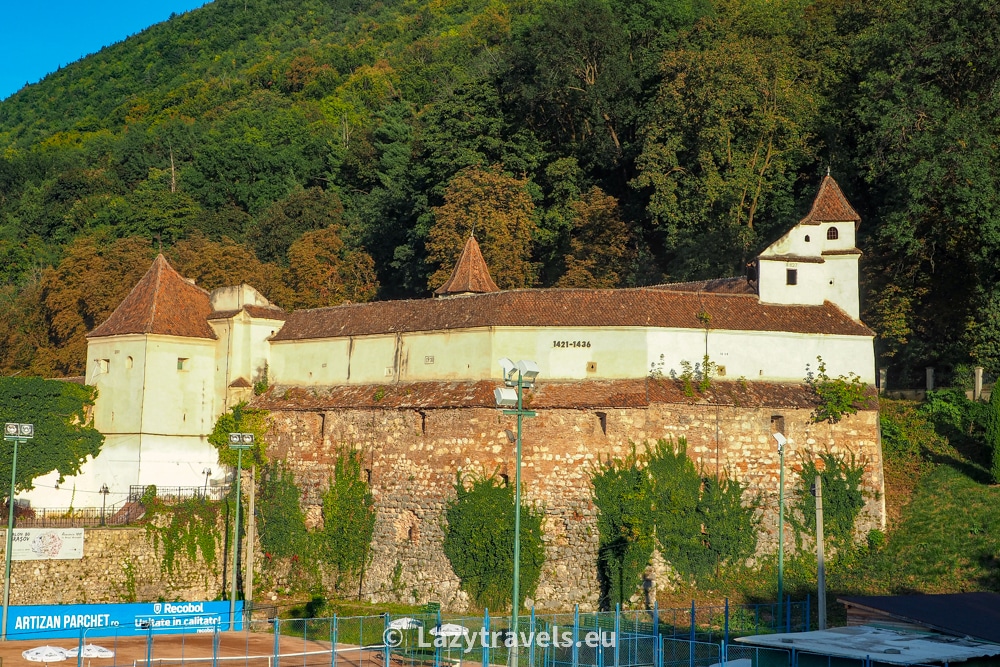 The Weavers' Bastion in Brașov bathed in the glow of the setting sun